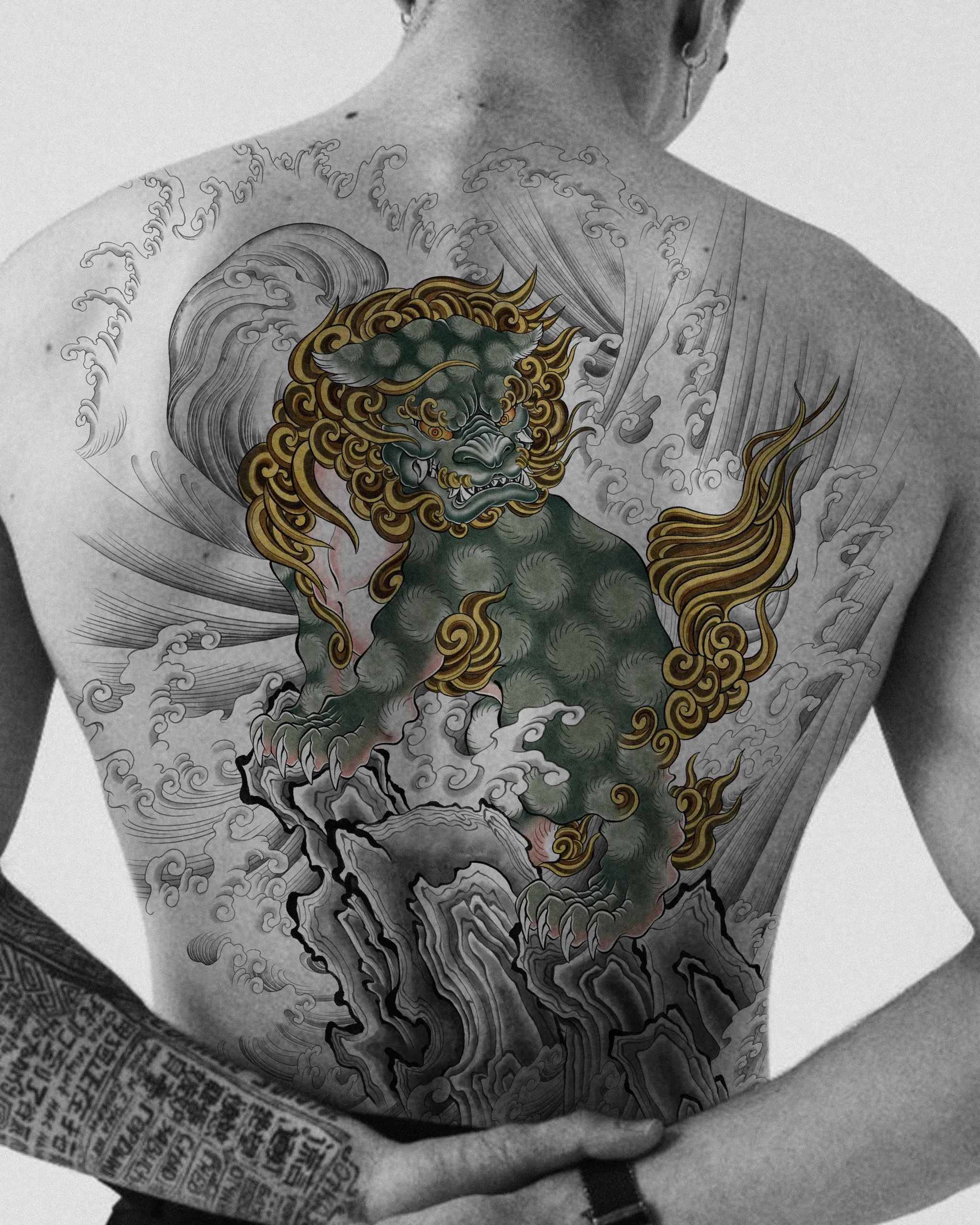 Haetae on Rock and Waves — Haetae tattoo on skin