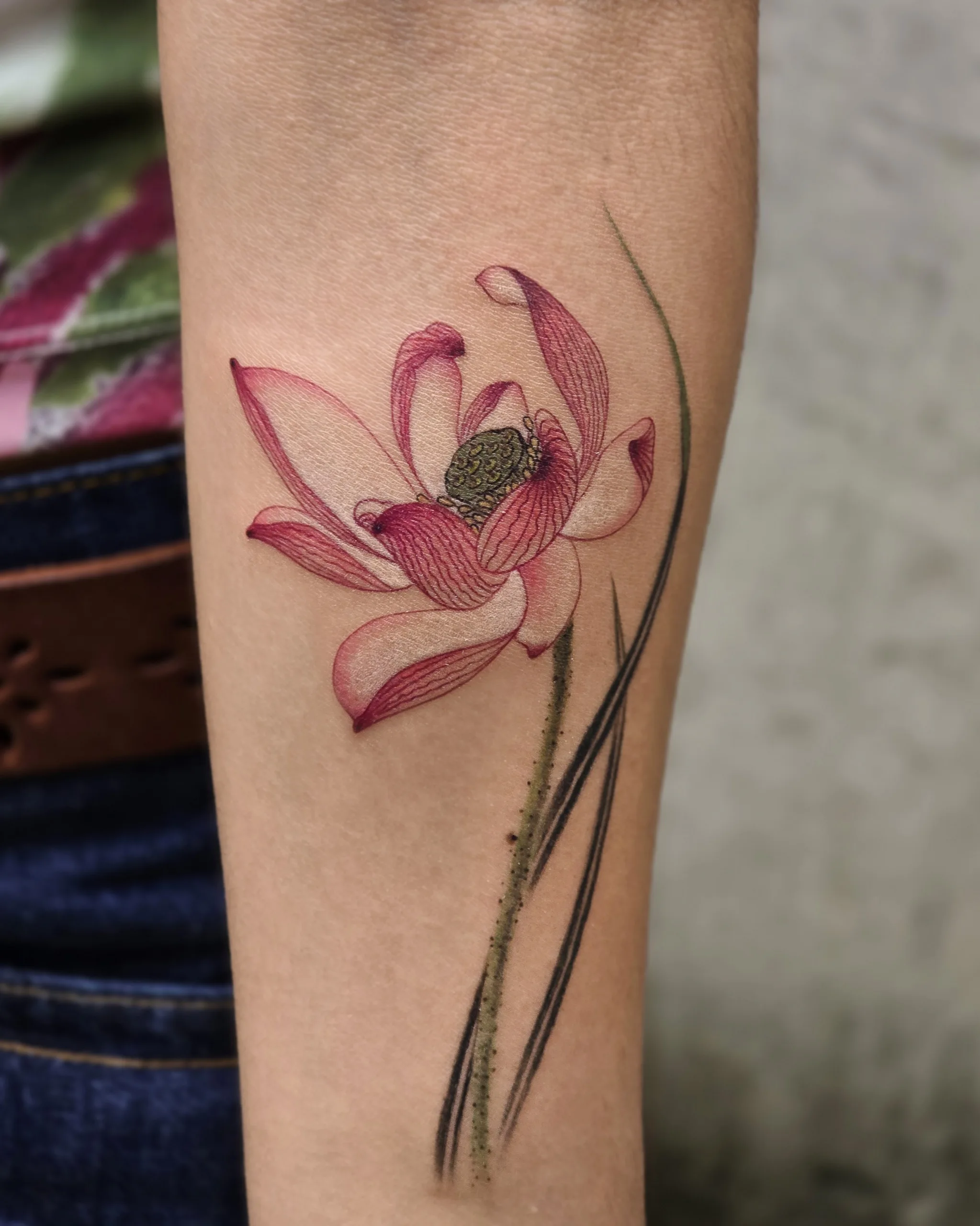 Red Lotus — Lotus tattoo on skin
